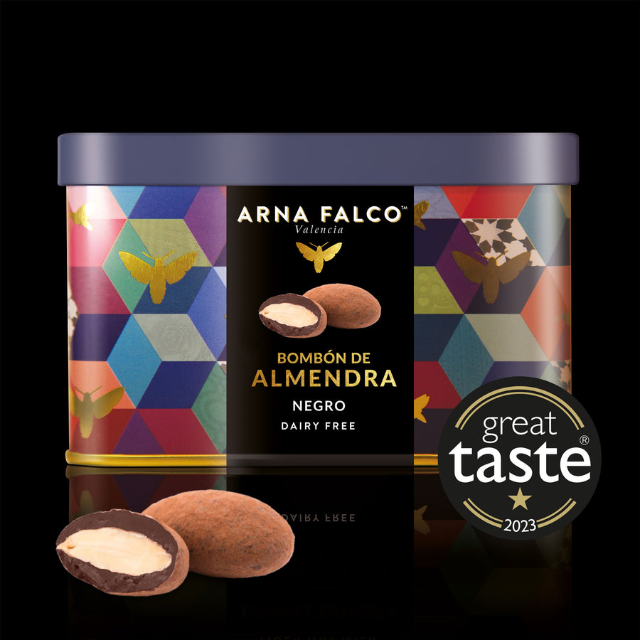 A colourful tin box of Dairy-Free, dark chocolate coated almonds by Arna Falco Valencia, featuring a "Great Taste 2023" award label and decorated with a geometric and butterfly pattern.